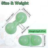 Close-up of dual stainless steel rattles inside the beads